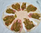 A picture of step 4 of Goat Cheese, Pesto, and Prosciutto Croissants.