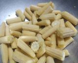 A picture of step 1 of Baby Corn Massala.