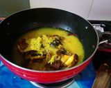 A picture of step 5 of Muri Ghonto (Fish head curry with lentils).