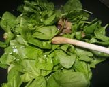 A picture of step 3 of Sauteed mushrooms and wilted spinach in garlic butter.