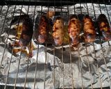 A picture of step 5 of Sausages with roasted vegetables in a tomato sauce.