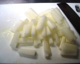 A picture of step 1 of Stir-fried and Simmered Daikon Radish, Pork, and Atsuage.