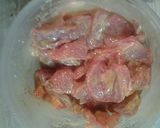 A picture of step 1 of Ramen noodles pork and green bean stirfry.