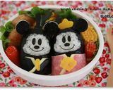 A picture of step 13 of Doll Festival Bento with Mickey and Minnie Onigiri.
