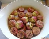 A picture of step 2 of Artichokes in Oil.