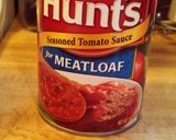A picture of step 6 of Meatloaf with rice in the middle.