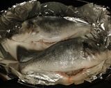 A picture of step 1 of Sea Bass with spinach and white wine.