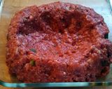 A picture of step 3 of Meatloaf with rice in the middle.