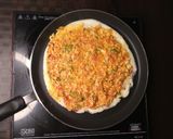 A picture of step 2 of Schezwan paneer masala dosa.
