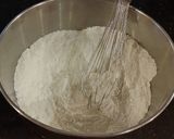 A picture of step 3 of Vanilla Layer Cake with Lemon Cream Filling and Lemon Whipped Cream Frosting.