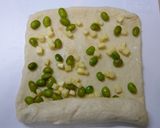 A picture of step 7 of Edamame and Cheese Rolled Bread.