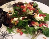 A picture of step 5 of Pomegranate baby leaf rocket salad.
