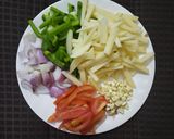 A picture of step 1 of Potato Capsicum fry.