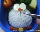 A picture of step 11 of Easy Charaben Doraemon with Nori Seaweed.