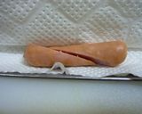 A picture of step 2 of Character Bento : 2 Octopus with 1 Sausage.