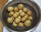 A picture of step 1 of New Potatoes Simmered in Miso.
