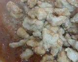 A picture of step 5 of Orange Chicken with fried rice.