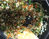 A picture of step 5 of Fried rice-a chinese dish served with manchurian.