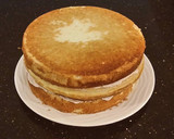 A picture of step 30 of White Layer Cake with a Raspberry Swirl Cheesecake center layer and a Raspberry Cream Frosting.