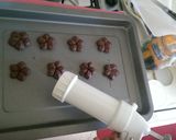 A picture of step 7 of Chocolate bisquits with cookie press machine.