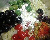 A picture of step 1 of Lettuce olive and tomato salad.