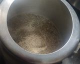 A picture of step 3 of Rajasthani Bajra Khichda (pearl millet).