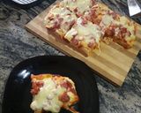 A picture of step 8 of Mozeralla and sausage Pizza.