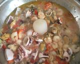 A picture of step 3 of Seafood Saganaki.