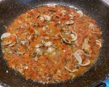 A picture of step 1 of Spaghetti with Squid Ink, Clams, and Pistachios.