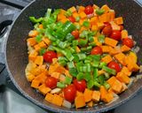A picture of step 11 of Sweet Potato with Green Bell Pepper and Tomatoes in Fruity Sauce.