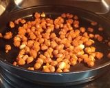 A picture of step 2 of Baked masala peanuts.