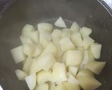 Foto del paso 1 de la receta: Papas rellenas con pino y queso
