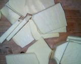 A picture of step 1 of Fried yam coated in curryed flour.