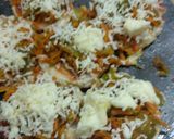 A picture of step 3 of Cheesy pizza shots.