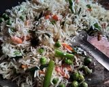 A picture of step 2 of Fried rice doi potato raita and salad.