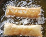 A picture of step 8 of Moong Dal Halwa Cigars dipped in Shaahi Rabdi.