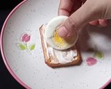 A picture of step 2 of Tuc Egg Canapes.