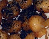 A picture of step 4 of Puff puff with crushed Oreo.