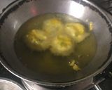 A picture of step 3 of Vadapav with green spicy chutney.