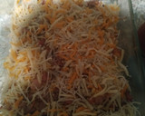 Foto del paso 4 de la receta: Patatas fritas con bacon, jamón y queso rallado