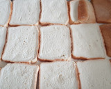 Foto del paso 2 de la receta: Torrijas de leche con cobertura de maní, al horno