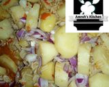 A picture of step 8 of Jollof rice with irish potato.