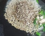 A picture of step 1 of Jeera Rice.