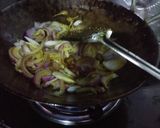 A picture of step 2 of Fried chilli with onion and raw mango.