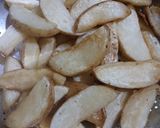 A picture of step 2 of Seasoned Crispy Potato Wedges.