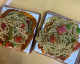 A picture of step 16 of Sunday Maggi Dhamaka Lunch #Maggipizza #Maggisizzler #MaggicabbageRolls #MaggiManchurian #MaggiSoup.