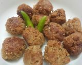 A picture of step 1 of Til narkol postor bora (Sesame coconut and poppy seed fritters).