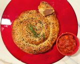 A picture of step 12 of Boerewors sausage roll.