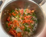 A picture of step 4 of Yellow Rice with Jalapeños and Tomatoes.