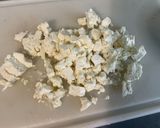 A picture of step 12 of Composed Salad with Black Tomatoes, Cucumber, Red Onion, Feta, and Parsley.